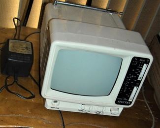 Vintage Spectra 5" portable television. Powers on.