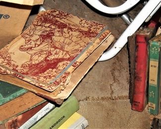 Large collection of dusty old and collectible books