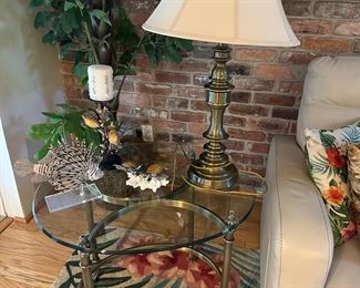 Two round glass top end tables