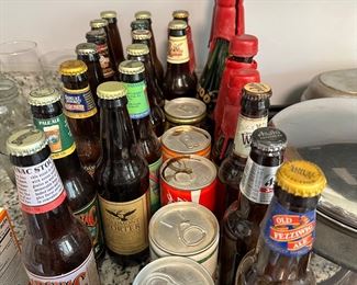 empty vintage beer bottles and coke cans
