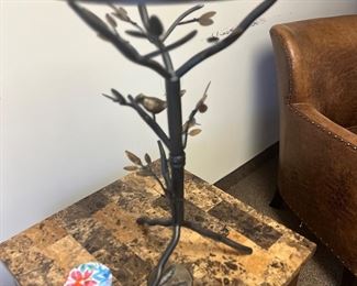Metal tree table with birds on it