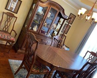 Formica top dining room table with six chairs and leash inserts, very sturdy.. nice China cabinet