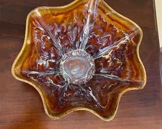 Ruffled pottery are signed