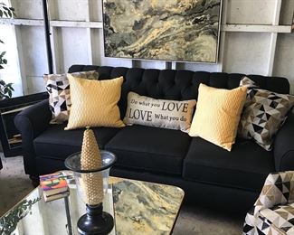 New Black Sofa and Glasstop coffee table with coordinated wall art and decor