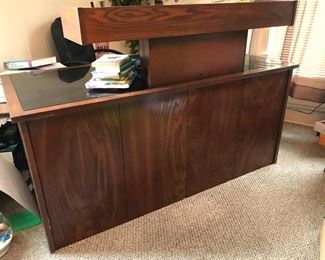 Beautiful walnut finish desk with a Glasstop for writing surface and pullout for keyboard. 