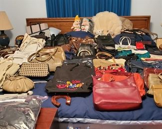 King size bed and lots of leather purses.
Bed set includes
Head board/Frame
Two night tables &
Dresser with mirror 