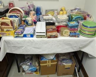 Lots of disposable plates, napkins, cups etc