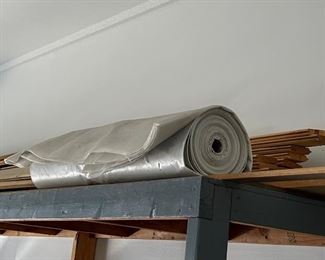 ROLL OF PLASTIC + MISC LUMBER