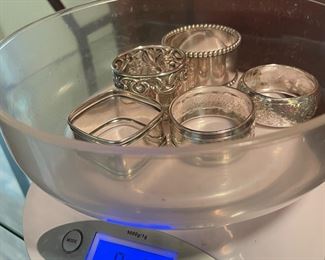 $100 	
Sterling lot of napkins rings (5) 