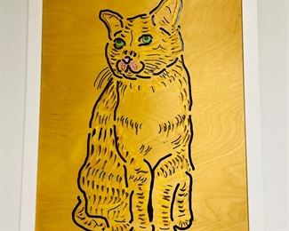 Etched wood panel with paint applied.