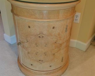 Large round, glass topped storage table.
