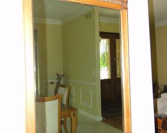 Square beveled mirror with corner detailing and double arched top