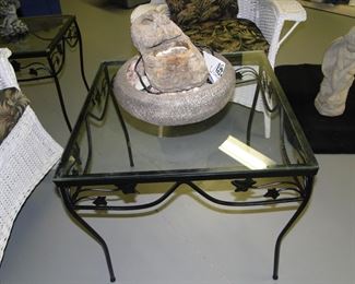 Rock fountain, and it looks like another set of metal and glass tables