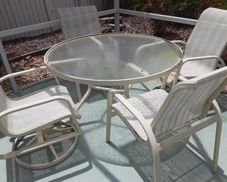 Table with 4 bounce (rocking) chairs