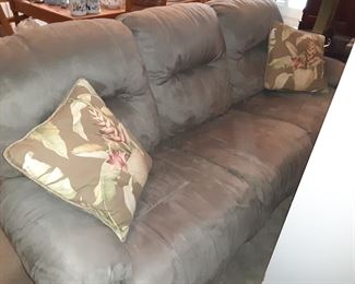 Taupe/Gray Couch with Recliners on each end. There is a Loveseat that matches and also has 2 Recliners
