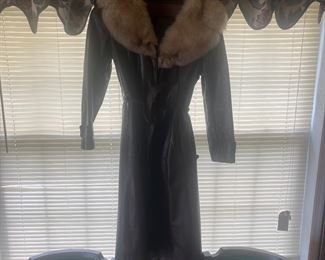 Womans long leather coat with fur trim