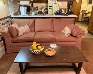 This family room three cushion earth tone sofa is in excellent condition and will compliment several different types of decor