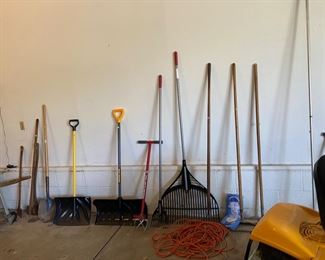 Garage full of garden tools, hand tools and a few power tools.