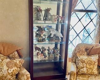 Curio cabinet filled with beautiful birds