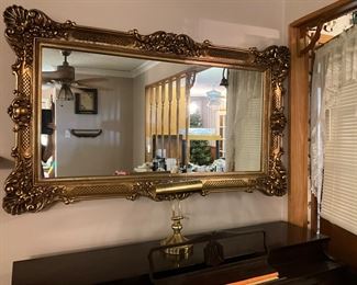 Mirror over piano; light 