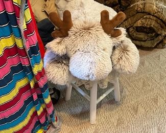 Another stuffed animal on small stool