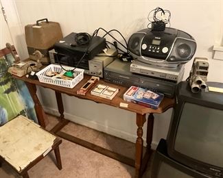 Table, boom box, cards, electronics 