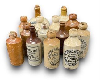 14 Antique Stoneware Advertising Bottles

