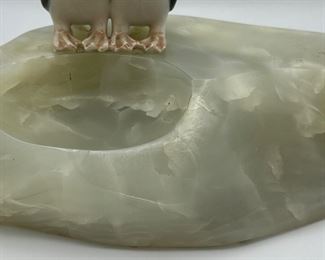 Awe...Two penguins smooching on the side of a slab of onyx.  We believe the penguins are Royal Copenhagen and were attached to this onyx rock specimen.  Clever.