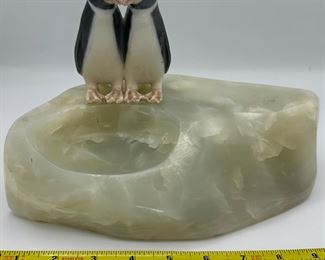 Awe...Two penguins smooching on the side of a slab of onyx.  We believe the penguins are Royal Copenhagen and were attached to this onyx rock specimen