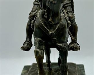 This is a Bronze of Medieval Knight on horseback.  His sword is missing and the Pommel is bent.  Solid Marble Base, very heavy.