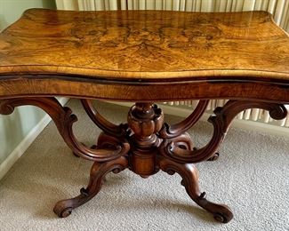 Stunning Victorian Burr Walnut Card/Game Table. Circa 1860's in Excellent Museum Quality Condition.. Features Rotating Top and Opens for larger surface with Green Felt Game Surface.  Size: 33.8" W x 16.9" D x 28.3" H