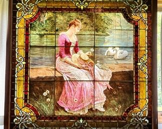 Striking Reverse Painted Stained Glass Window with original wood frame in the style of Alphonse Mucha. Absolutely perfect condition, no cracks or pieces missing. Check out the following photos of this beautiful and "One of a Kind'"Treasure. Size of this piece is a whopping 5' x 5'.