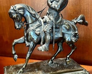 This is a Bronze of Medieval Knight on horseback.  His sword is missing and the Pommel is bent.  Solid Marble Base, very heavy.
