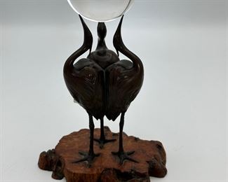 Signed Japanese Art Deco Bronze Okimono of 3 Cranes each on one leg with up tuned beaks  balancing a crystal ball in a live edge wood base.