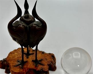 Signed Japanese Art Deco Bronze Okimono of 3 Cranes each on one leg with up tuned beaks  balancing a crystal ball in a live edge wood base.
