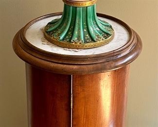 Beautiful Royal Doulton Vase with a pedestal base and fluted top.  Colors are absolutely vivid and in perfect condition.  Circa 1920's.  The Pedestal is solid wood with round Marble top and Secret Door