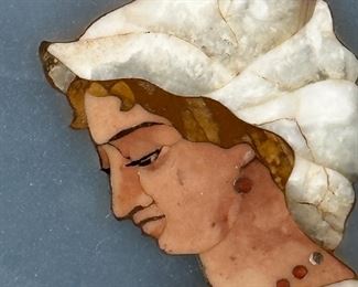 This is a stone portrait made from various stones and painted, a truly  unique piece!