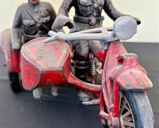Vintage Cast Iron Hubley Toy Indian Motorcycle with Side Car and 2 Policeman.  All Original including tires and apron. weight in 4 lbs. Missing part of Handlebar on left side of Motorcycle.