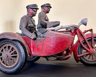 Vintage Cast Iron Hubley Toy Indian Motorcycle with Side Car and 2 Policeman.  All Original including tires and apron. weight in 4 lbs.