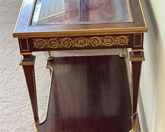 French 19th C. Louis XVI Mahogany Ormolu Display Table with Gold Gilt Detail and Glass Top that opens the case with original Key.  One is selling on 1stDibs for $18,800 to give you an idea on this piece.