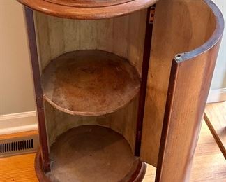 This antique pedestal is solid wood with round marble top and secret door