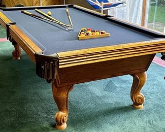 8' Professional Pool Table by Olhausen with Royal Blue Felt. Classic Oak, Leather Pockets, Cue Rack and Cues with all accessories including Cover.  We have a couple of companies that  can move this for you.