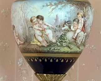 French Sevres Porcelain Urn on Bronze Door Pedestal Circa 19th Century.  Ormolu detail and awesome Lions on middle section.