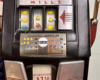 Here's an old antique Five Cent "One Arm Bandit" with a "guaranteed $7.50 payout" by Mills