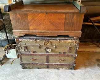 The trunk below is a military trunk in pretty rough shape, but it is quite old.  The one atop I believe is a cedar-lined chest, also could use some TLC