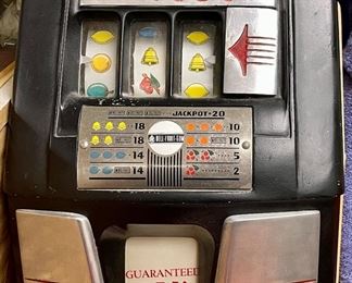 Here's an old five cent slot machine, or "one-armed bandit" with a guaranteed $7.50 payout, lol!  Fun vintage piece
