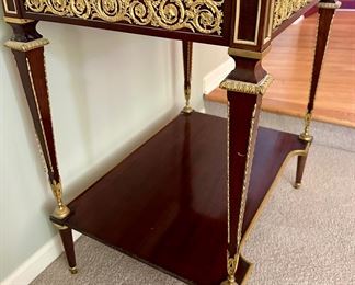 French 19th C. Louis XVI Mahogany Ormolu Display Table with Gold Gilt Detail and Glass Top that opens the case with original Key.  One is selling on 1stDibs for $18,800 to give you an idea on this piece.