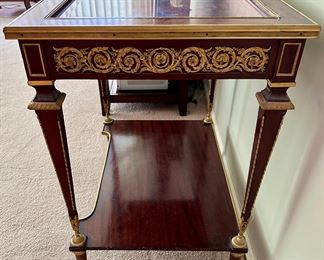 French 19th C. Louis XVI Mahogany Ormolu Display Table with Gold Gilt Detail and Glass Top that opens the case with original Key.  One is selling on 1stDibs for $18,800 to give you an idea on this piece.