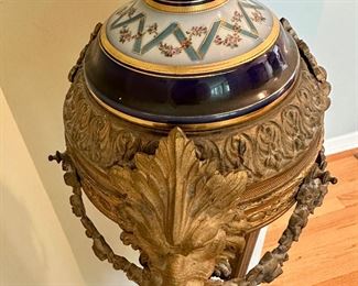 French Sevres Porcelain Urn on Bronze Door Pedestal Circa 19th Century.  Ormolu detail and awesome Lions on middle section.