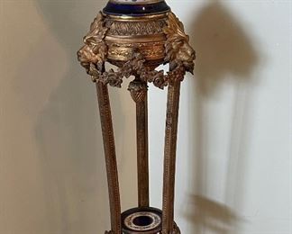 French Sevres Porcelain Urn on Bronze Door Pedestal Circa 19th Century.  Ormolu detail and awesome Lions on middle section.